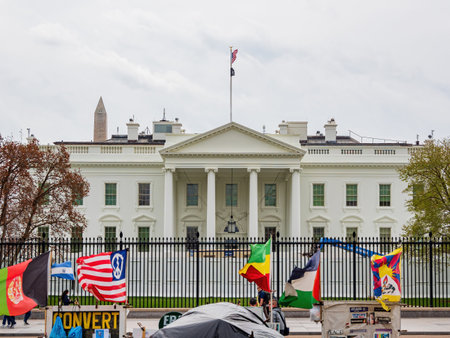 Washington DC, MAR 31 2022 - Man protest with sign and flags in front of The White Houseのeditorial素材