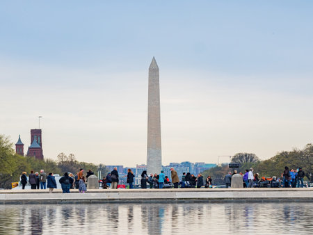 Washington DC, MAR 31 2022 - Overcast view of the Washington Monument with reflectionのeditorial素材