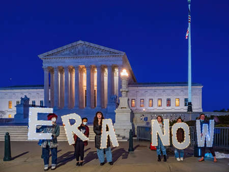 Washington DC, APR 1 2022 - Girls holding Equal Rights Amendment sign in front of the Supreme Court Libraryのeditorial素材
