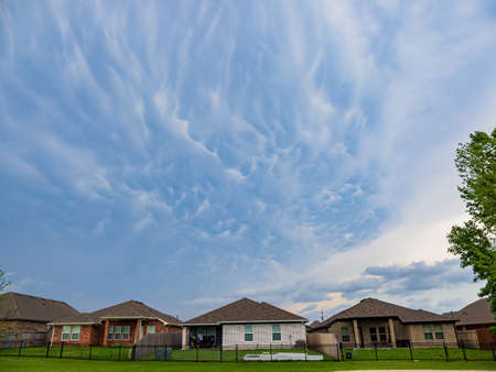 Sunset beautiful clouds over community trail at Edmond, Oklahomaの写真素材