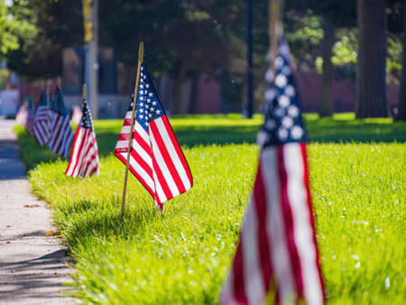 Close up shot of many America flag on ground at Cheyenne, Wyomingの写真素材