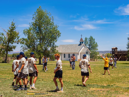 Wyoming, JUL 9 2022 - Student playing baseball in Wyoming Territorial Prisonのeditorial素材