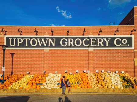 Oklahoma, SEP 19 2022 - Exterior view of the Uptown Grocery selling pumpkin for Halloweenの写真素材