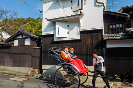 Kyoto, NOV 16 2013 - Sunny view of man pulled cart at Arashiyamaのeditorial素材