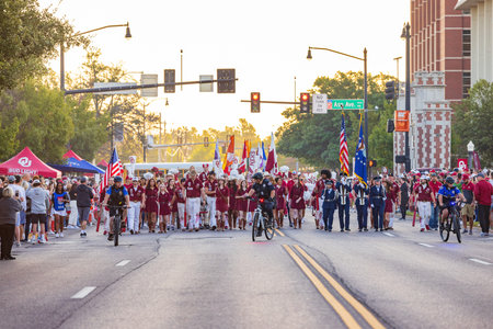 Oklahoma, OCT 15 2022 - Sunny view of the student Marching Band walking in Homecoming paradeのeditorial素材