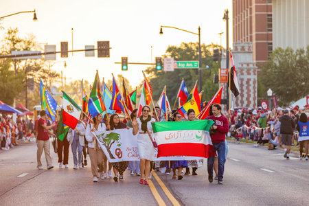 Oklahoma, OCT 15 2022 - Sunny view of the College of International Studies walking in Homecoming paradeのeditorial素材