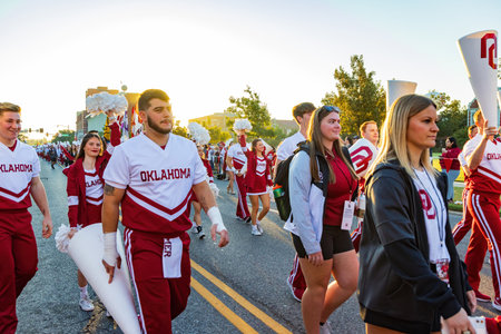 Oklahoma, OCT 15 2022 - Sunny view of the student Marching Band walking in Homecoming paradeのeditorial素材
