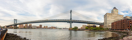 Sunset afterglow of the Manhattan Bridge and New York City skyline at New York