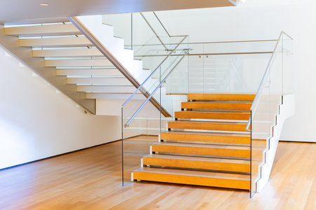 Interior view of a moden design wooden stairs and rail at New York