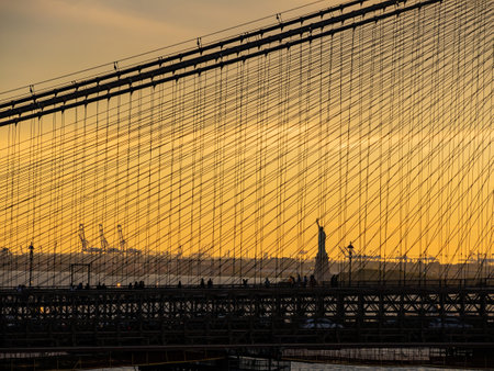 Sunset afterglow of the Brooklyn Bridge and New York City skyline at New Yorkの写真素材