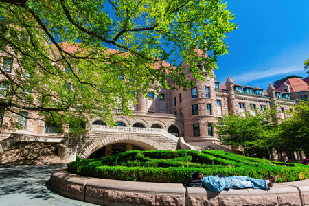 New York, SEP 14 2014 - Man sleeping in front of The american Museum of Natural Historyのeditorial素材