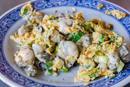 Close up shot of savory fried oyster egg dish at Taipei, Taiwanの写真素材