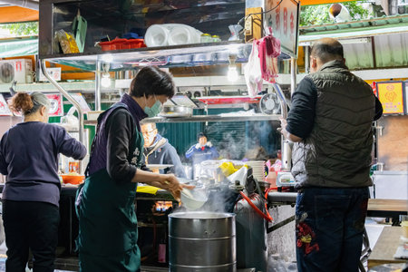 Taipei, DEC 17 2022 - Morning view of a Milkfish street vendor in the traditional Nanjichang Night Marketのeditorial素材