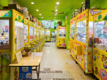 Tainan, JAN 4 2023 - Night interior view of a claw machine specialist storeのeditorial素材