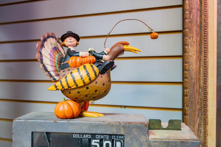 New Mexico, NOV 24 2022 - Get a close-up look at the delightful details of a little man hanging from a whimsical turkey toyのeditorial素材