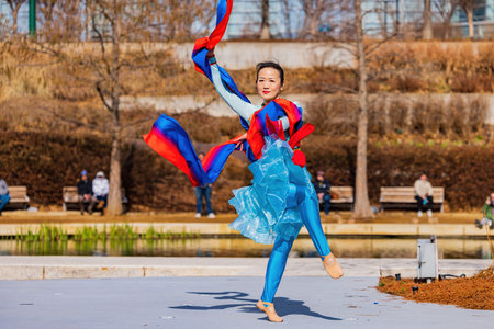 Oklahoma, JAN 21 2023 - Sunny view of  a woman dancer doing Chinese style danceのeditorial素材