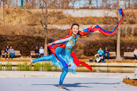 Oklahoma, JAN 21 2023 - Sunny view of  a woman dancer doing Chinese style danceのeditorial素材
