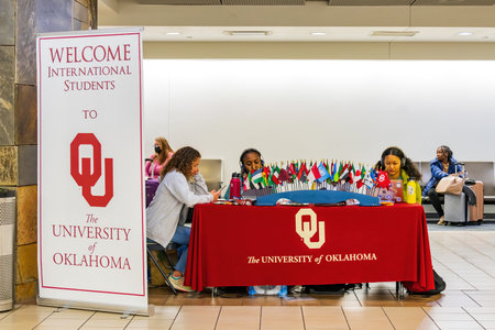 Oklahoma, JAN 10 2023 - University of Oklahoma booth welcoming international student in the airportのeditorial素材
