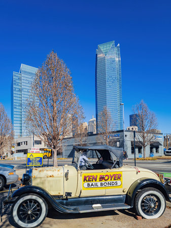 Oklahoma, JAN 16 2023 - Sunny exterior view of the skyscrapper with an antique car in downtownのeditorial素材