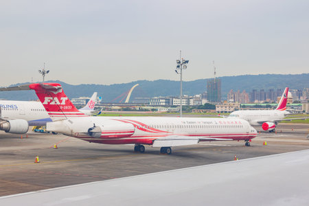 Texas, JAN 9, 2023 - Overcast view of Far Eastern Air Transport airplane parked at the Taipei Songshan Airportのeditorial素材