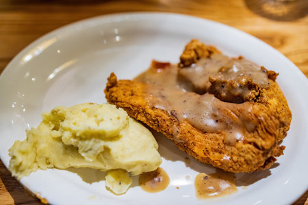 Close up shot of deep fried chicken steak with mashed potato at Texasの写真素材