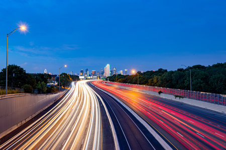 Sunset Dallas skyline with highway at Texasの写真素材