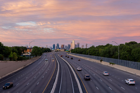 Texas, JUL 2 2023 - Sunset Dallas skyline with highwayのeditorial素材