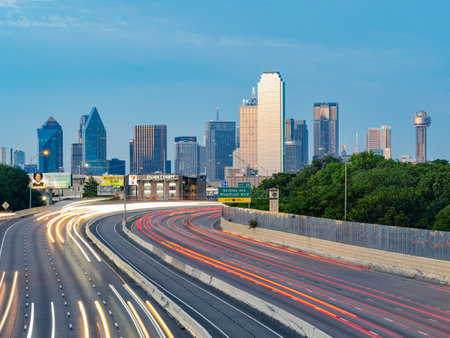 Texas, JUL 2 2023 - Sunset Dallas skyline with highwayのeditorial素材