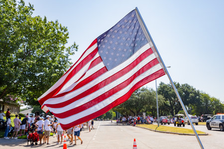 Texas, JUL 4 2023 - Sunny view of a July 4th community parade in Dallasのeditorial素材