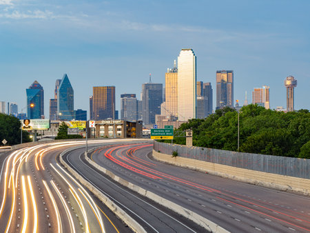 Texas, JUL 2 2023 - Sunset Dallas skyline with highwayのeditorial素材