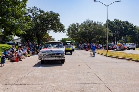Texas, JUL 4 2023 - Sunny view of a July 4th community parade in Dallasのeditorial素材