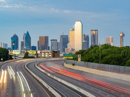 Texas, JUL 2 2023 - Sunset Dallas skyline with highwayのeditorial素材
