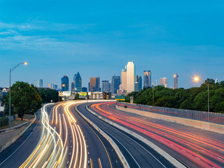 Texas, JUL 2 2023 - Sunset Dallas skyline with highwayのeditorial素材