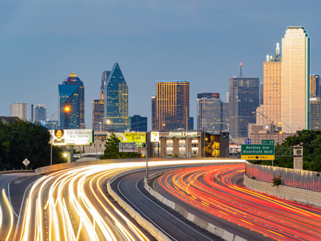 Texas, JUL 2 2023 - Sunset Dallas skyline with highwayのeditorial素材