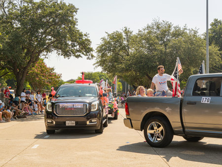 Texas, JUL 4 2023 - Sunny view of a July 4th community parade in Dallasのeditorial素材
