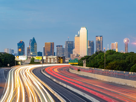 Texas, JUL 2 2023 - Sunset Dallas skyline with highwayのeditorial素材