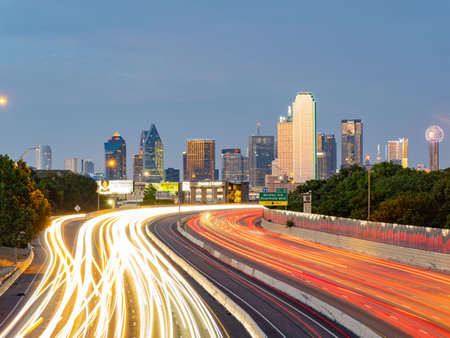 Texas, JUL 2 2023 - Sunset Dallas skyline with highwayのeditorial素材