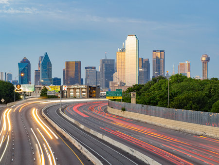 Texas, JUL 2 2023 - Sunset Dallas skyline with highwayのeditorial素材