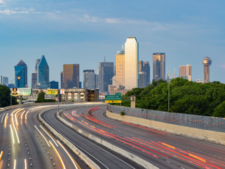 Texas, JUL 2 2023 - Sunset Dallas skyline with highwayのeditorial素材