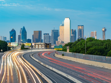 Texas, JUL 2 2023 - Sunset Dallas skyline with highwayのeditorial素材