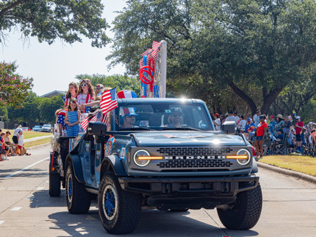Texas, JUL 4 2023 - Sunny view of a July 4th community parade in Dallasのeditorial素材