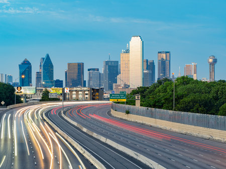 Texas, JUL 2 2023 - Sunset Dallas skyline with highwayのeditorial素材