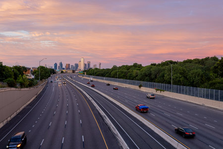 Texas, JUL 2 2023 - Sunset Dallas skyline with highwayのeditorial素材
