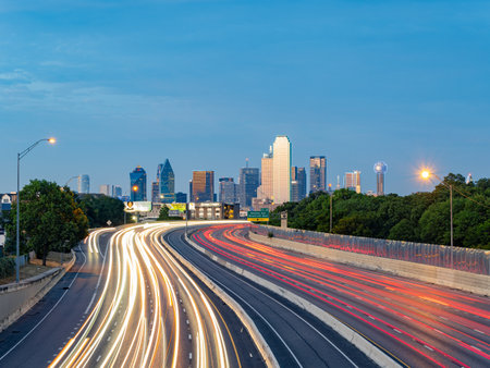 Texas, JUL 2 2023 - Sunset Dallas skyline with highwayのeditorial素材