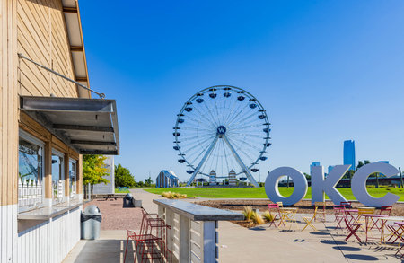 Oklahoma, AUG 16 2023 - Sunny view of the ticket booth at Wheeler Ferris Wheel, Wheeler Districtのeditorial素材