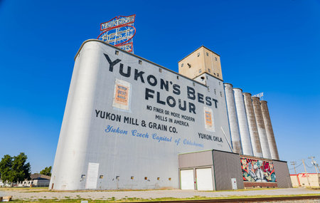 Oklahoma, SEP 3 2023 - Sunny exterior view of the Yukon Mill and Grain Coのeditorial素材