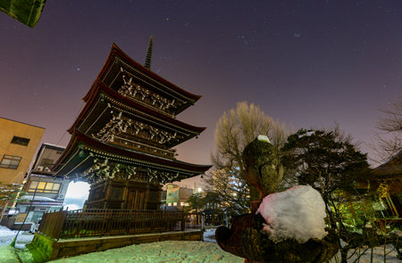 Night exterior view of a Japanese temple with starry sky at Takayama, Japanの写真素材