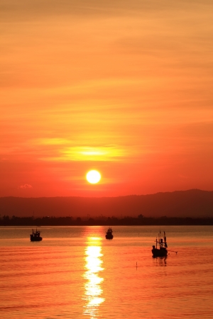 Long tailed boat at sunset ,  south of Thailandの写真素材