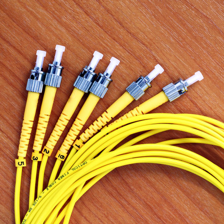 Fiber optic cable on a wood table 
