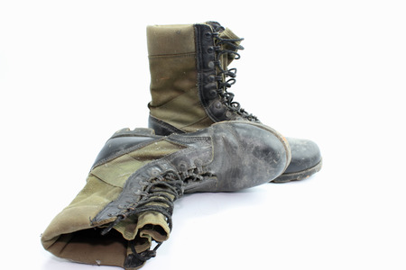 Old  combat boots isolated on white .の写真素材